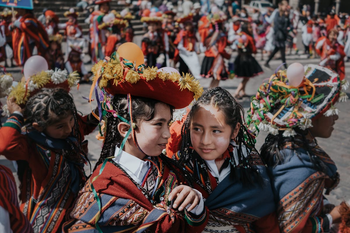 Children in traditional Cusco clothing during a local festival (cusco with kids) | Cusco Tours